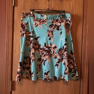 George stretch A-line skirt. Turquoise with cream and brown roses. Size 14